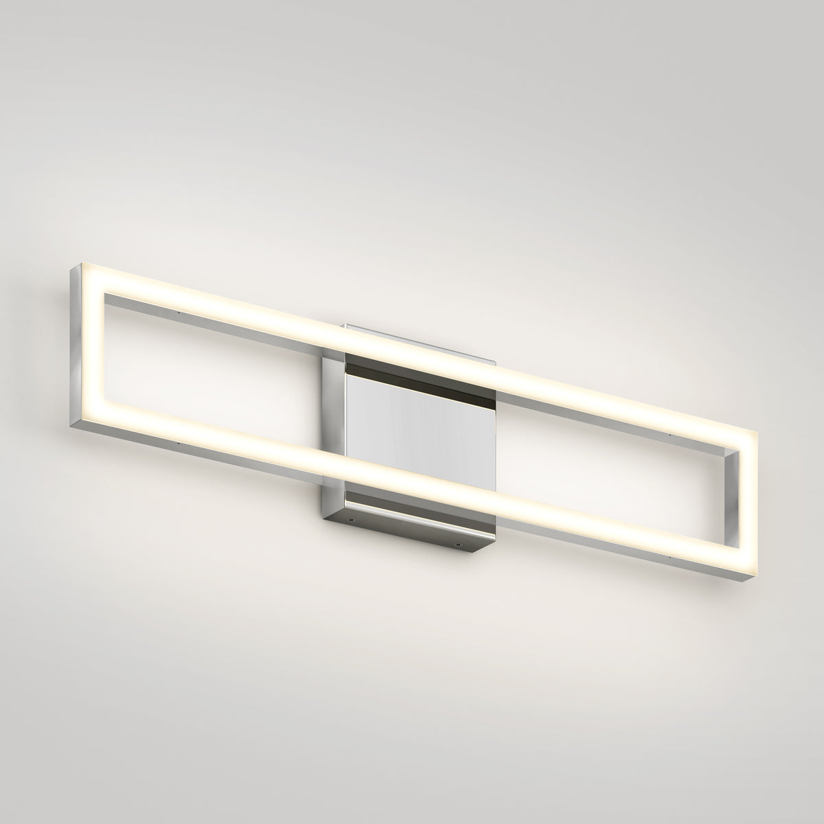 The Artika Dover 27-in Integrated LED 5-CCT Vanity Light Bar features a chrome finish and sleek rectangular design, mounted on a light gray wall—an ideal modern touch for any bathroom.