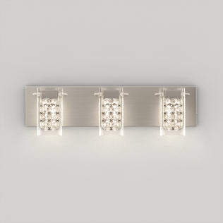The Artika Crystal Cube LED bathroom vanity light 5 CCT features three rectangular lights with glass panels and sparkling crystal accents, mounted on a brushed metal backplate and displayed against a plain light gray background.