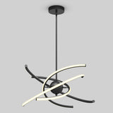 A modern black pendant chandelier with two curved LED light bars crossing around a central sphere, suspended from the ceiling by a rod, set against a plain gray background.