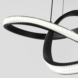 A modern, sculptural LED chandelier with black curved loops and textured, illuminated edges, suspended by thin wires against a plain light gray background.
