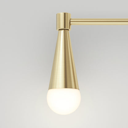 The Artika Wayden LED mid-century bathroom vanity light 3 CCT showcases a modern brushed brass conical design with a round white frosted bulb, set against a plain light gray background.