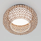 A round ceiling light with a woven rattan or wicker lampshade, featuring an open lattice pattern, glowing softly against a plain white ceiling.