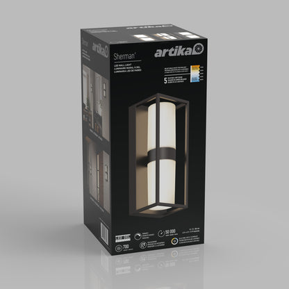 Box of an Artika Sherman modern LED indoor-outdoor wall light 5 CCT. The packaging shows the black rectangular fixture with a white cylindrical center, details about its features, and images of it installed on a wall.