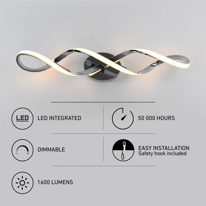 The Artika Swirl modern LED bathroom vanity light features a twisted design and is mounted on a gray wall; icons and text showcase integrated LEDs, dimmable 1600 lumens, 50,000-hour lifespan, and easy installation—ideal for modern spaces.
