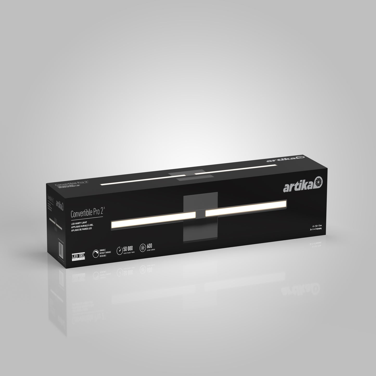 A rectangular black box labeled “Artika” displays the Convertible Pro 2 Wall Mounted bathroom vanity light, featuring product details and an illuminated light image on the packaging, set against a plain gray background.