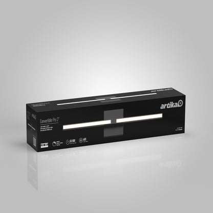 A sleek black box with the Artika logo showcases the Convertible Pro 2 Wall Mounted bathroom vanity light, highlighting features like a 50,000-hour lifespan and 650 lumens against a light gray background.