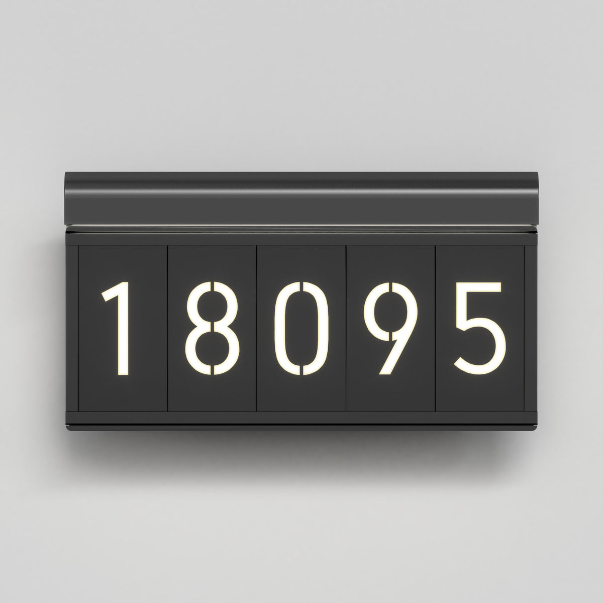 A modern, rectangular black flip clock displaying the number 18095 in white illuminated digits against a light gray background.