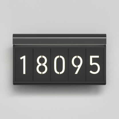 A modern, rectangular black flip clock displaying the number 18095 in white illuminated digits against a light gray background.