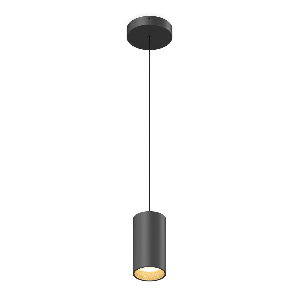 A modern, cylindrical black pendant light hangs from the ceiling by a thin cord, with the inside of the light fixture glowing warmly.
