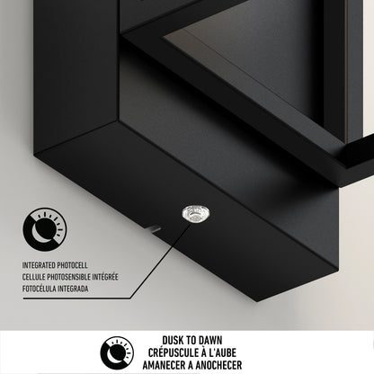 Close-up of the Artika Aurel Outdoor LED Light, 3CCT, highlighting its small round integrated photocell sensor and multilingual (English, French, Spanish) Dusk to Dawn icons and labels.