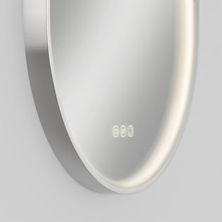 The Artika Royce LED mirror features a round design, defogger, memory, and digital clock at 8:00.