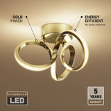 Modern ceiling light fixture with a gold finish and three intertwined LED rings. Labels highlight its energy efficiency, integrated LED, and 5-year warranty. Light glows warmly onto the ceiling. No bulbs required.