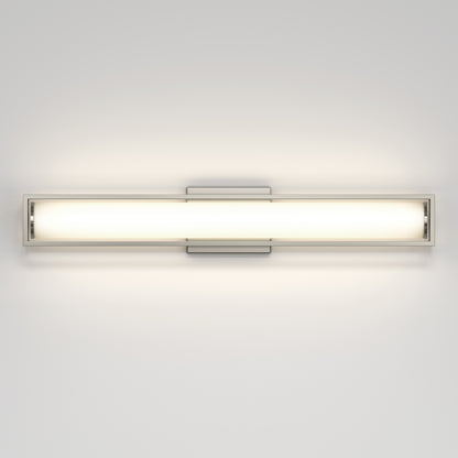 The Artika Venicia LED Wall Sconce features a modern rectangular design with a frosted glass shade, emitting soft, even light and mounted on a clean, light-colored wall.