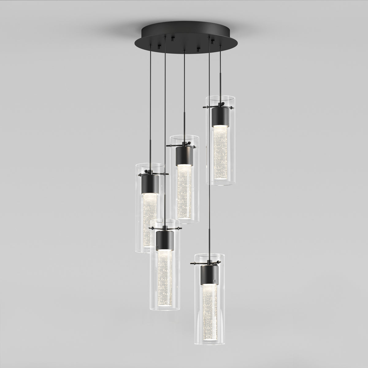 The Artika Essence 5-light LED pendant features five cylindrical glass lights hanging at varying lengths from a round black ceiling mount, offering a soft glow for a contemporary, elegant look.