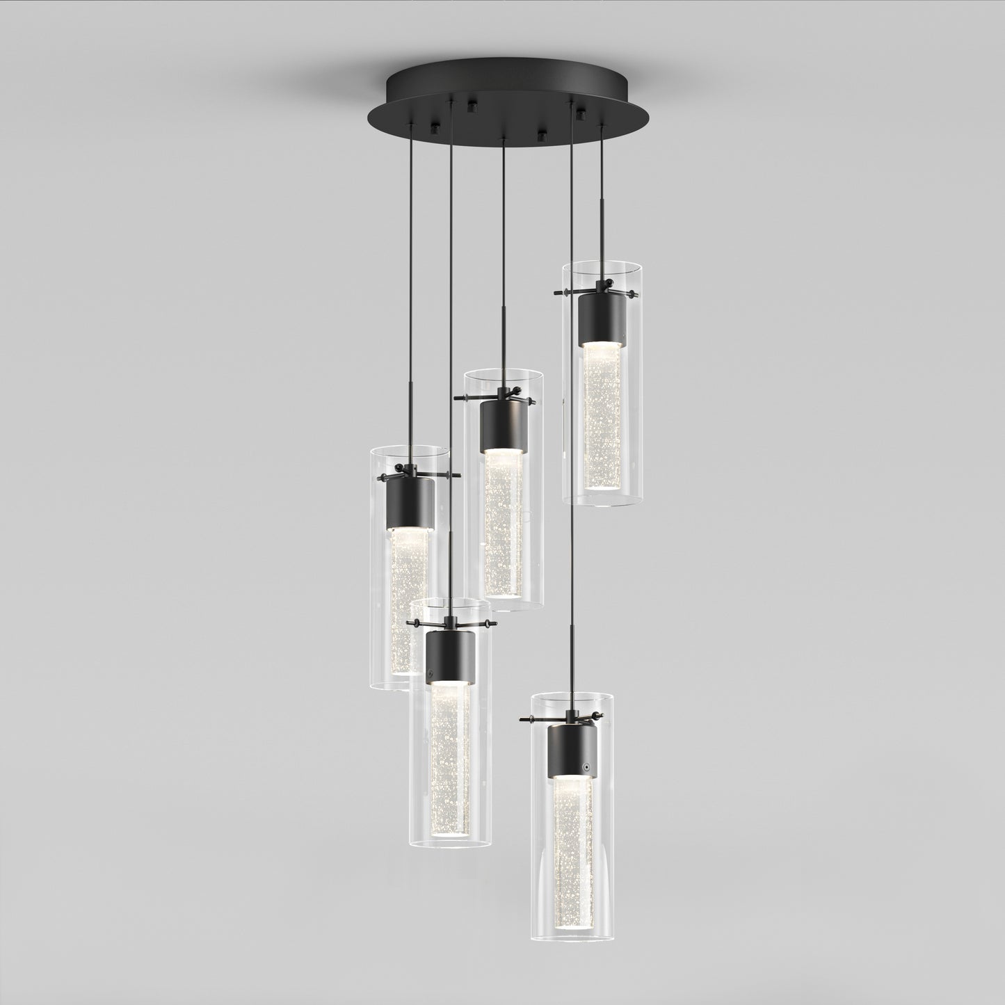 The Artika Essence 5-light LED pendant features five cylindrical glass lights hanging at varying lengths from a round black ceiling mount, offering a soft glow for a contemporary, elegant look.