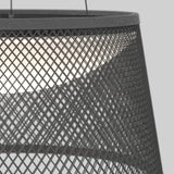 Close-up of a modern black metal pendant lamp with a diamond-patterned mesh shade, partially revealing a glowing light inside against a plain light gray background.