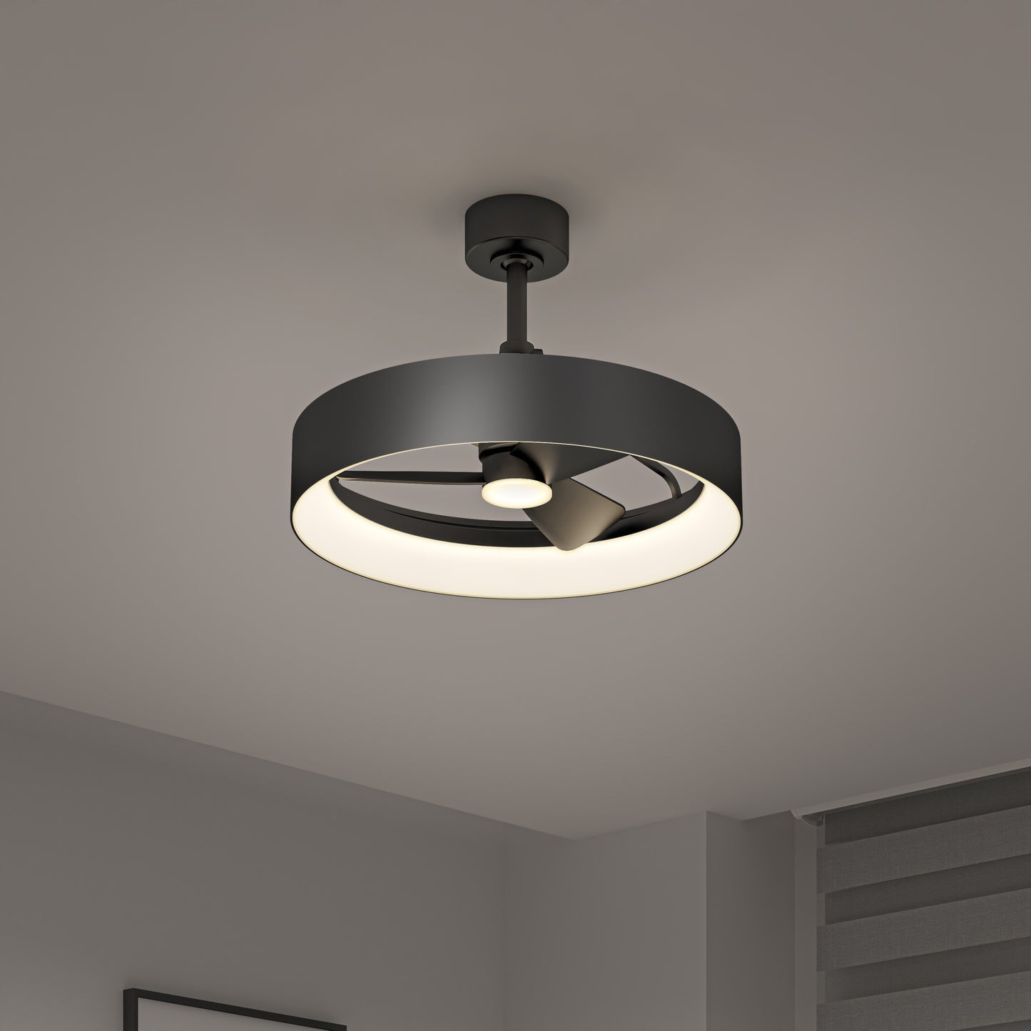 The Artika Austin 23 in. LED modern ceiling fan, featuring a circular black frame and built-in light fixture, is mounted on a white ceiling in a minimalist room with gray walls and horizontal window blinds. Includes remote control.