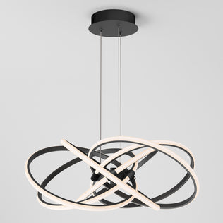The Artika Maelstrom LED pendant light features interlocking black and white rings suspended by two cables from a black ceiling mount, shown against a plain white background.