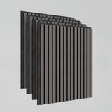 Five gray acoustic wall panels with evenly spaced vertical black slats are stacked in a staggered manner against a plain light background.