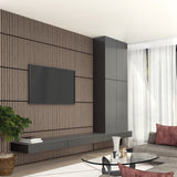 A modern living room with a wood slat accent wall, wall-mounted TV, sleek black cabinets, a low console, gray sofa with burgundy pillows, round glass coffee table, and a large window with sheer white curtains.