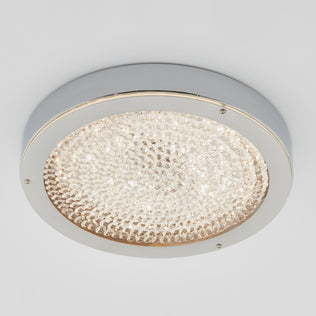 The Artika Glitter LED flush mount features a chrome rim and crystal-like finish, providing bright, energy-saving white light.