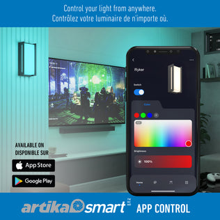A smartphone displays the Artika app with color and brightness controls for the Ryker smart RGB indoor-outdoor wall light. In the background, a wall-mounted Ryker light and TV are visible. Text in English and French promotes app control for smart lighting.
