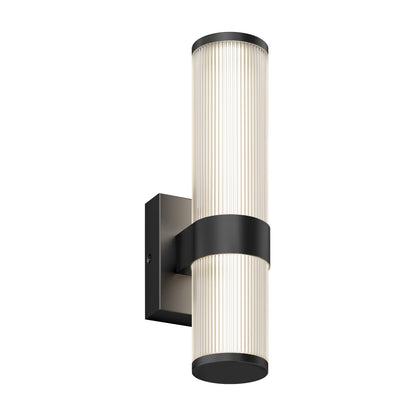 The Artika Mirado modern LED wall sconce 5 CCT features a cylindrical ribbed glass shade, black metal accents, and a rectangular wall plate, offering even illumination in a contemporary design.