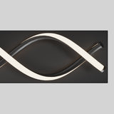 A modern wall light fixture with intertwined black and glowing white curved tubes, mounted on a dark rectangular background.