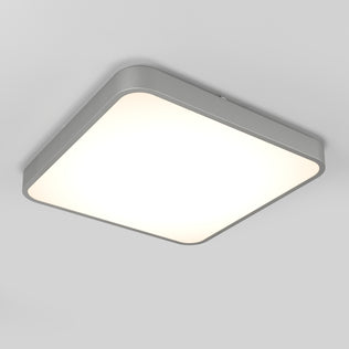 The Artika Europa 18 in. LED flush mount light features a modern, square design with rounded corners, a matte gray frame, and a diffused white panel. It includes a remote and is designed for seamless installation on plain white ceilings.