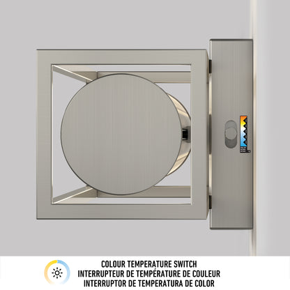 The Artika Venicia LED Wall Sconce, featuring a square metallic frame with a circular center, is wall-mounted beside a color temperature switch offering four icon-labeled options with a small triangle indicator.
