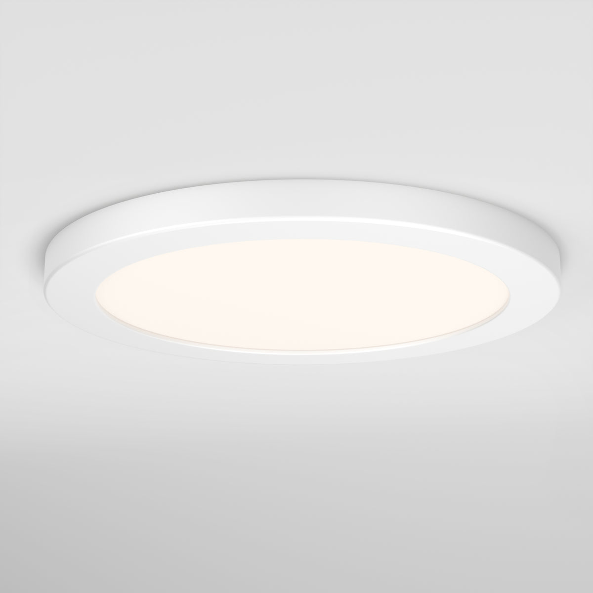The Artika Europa Disk 9 in. LED modern flush mount light, featuring 3 CCT settings, is illuminated and emits a soft, even glow against a plain white ceiling.