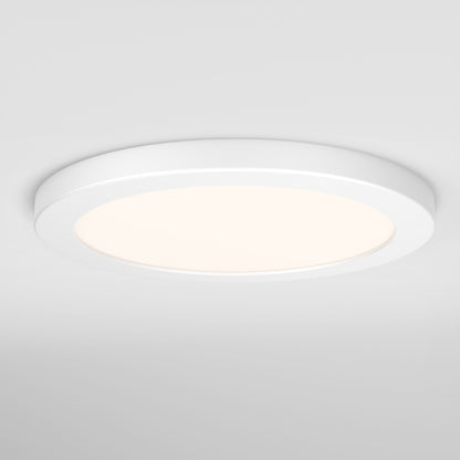 The Artika Europa Disk 9 in. LED modern flush mount light, featuring 3 CCT settings, is illuminated and emits a soft, even glow against a plain white ceiling.