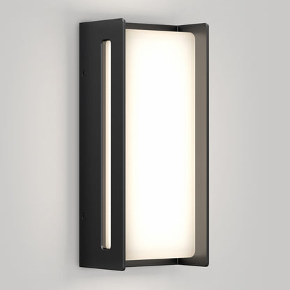 The Artika Ryker smart RGB indoor-outdoor wall light features a rectangular frosted glass shade and matte black frame, softly glowing against a light gray wall for a clean, contemporary look.