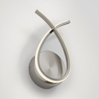 The Artika Gamma modern LED wall sconce 5 CCT features a brushed metal base and two abstract, looped LED light strips, elegantly mounted on a white wall.