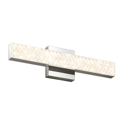 The Adeline modern LED bathroom vanity light by Artika features a rectangular wall-mounted design with a chrome finish and a textured, illuminated front panel, offering 3 selectable color temperatures.