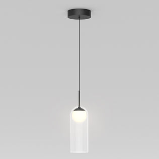 The Artika Mirah LED modern mid-century pendant light 3 CCT features a black ceiling mount and cord with a clear cylindrical glass shade around a glowing white bulb, shown against a plain gray background.