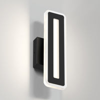 The Artika Evasion modern indoor-outdoor LED wall light 3 CCT features a black rectangular frame with a glowing white LED outline and hollow center, mounted on a black base against a light gray wall.