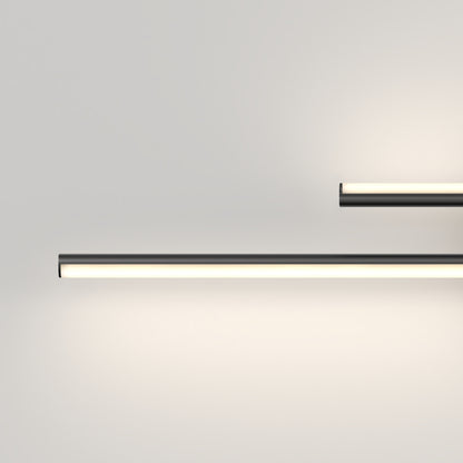 A plain, light-colored wall features two Artika Cisco modern LED bathroom vanity lights (5 CCT): a larger one placed lower and a smaller one higher, both casting a soft, even glow with sleek horizontal bars.