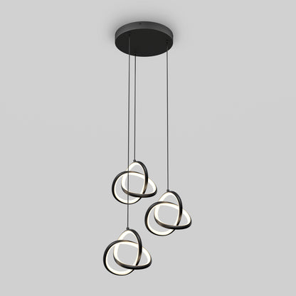 The Artika Zephyr 3-light LED pendant showcases three intertwined circular LED rings hanging at varied heights from a round black base, creating a modern look.