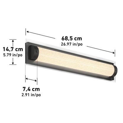 The Artika Glamour LED bathroom vanity light 3 CCT is a rectangular wall-mounted fixture with black ends, emitting warm light. It measures 68.5 cm (26.97 in) long, 14.7 cm (5.79 in) high, and 7.4 cm (2.91 in) deep.