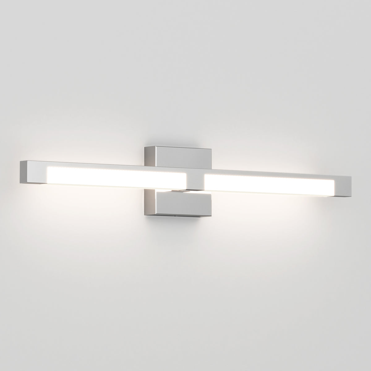 The Tivoli Modern LED Bathroom Vanity Light 5 CCT by Artika is a sleek, rectangular, wall-mounted fixture with a silver finish and adjustable bright white lighting that softly illuminates a plain white wall.