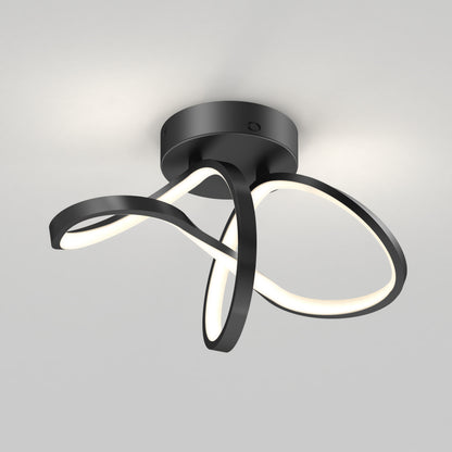 The Artika Loop modern LED flush mount light features black, ribbon-like arms on a round base and offers 3 CCT options, softly illuminating against a light-grey background.