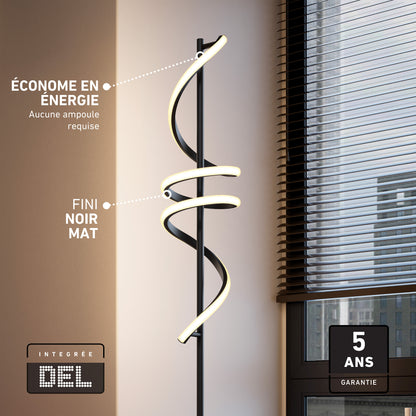 The Artika Coda modern LED floor lamp 5CCT, featuring a matte black finish and spiral design, stands by a window with blinds. French text notes its energy efficiency, integrated LED, minimalist style, and 5-year warranty.