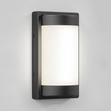 A modern rectangular wall sconce with a matte black frame and a frosted white glass cover, mounted on a light gray wall. The light appears to be evenly illuminated.