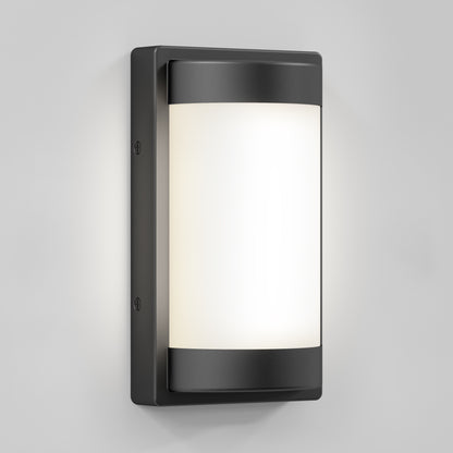 The Artika Fogo modern LED indoor-outdoor wall light 5 CCT features a black metal frame and frosted white glass, shown mounted on a light gray wall.