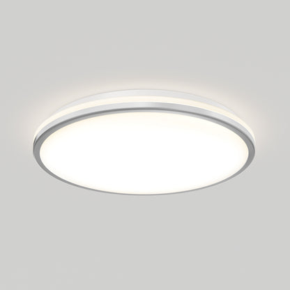 The Artika Macy 15 in. LED modern flush mount light features a white diffuser, slim metallic rim, and RGB Wifi control, providing a soft, even glow on a light gray ceiling.