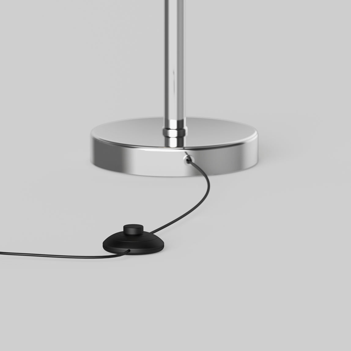A close-up of the Artika Pivot modern LED floor lamp 3 CCT, featuring a chrome base with a black power cord and round black foot switch on a light gray background.