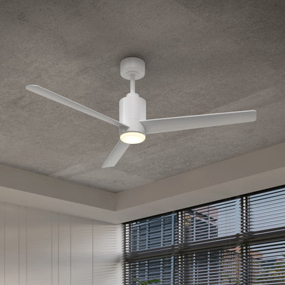 The Artika Ellison 52 in. LED modern ceiling fan with remote, featuring three white blades and a built-in light, is mounted on a gray ceiling in a room with large windows and horizontal blinds.