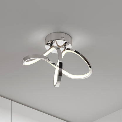Modern ceiling light fixture with intertwined, looped metallic arms featuring integrated LED strips, mounted on a white ceiling in a minimalist, contemporary room.