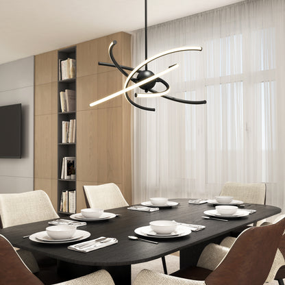 A modern dining room with a black table set for six, cream upholstered chairs, a unique abstract chandelier, floor-to-ceiling windows with sheer curtains, and built-in wooden bookshelves in the background.